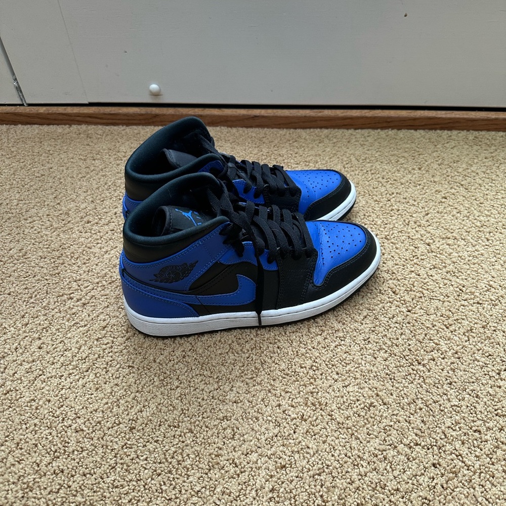 Blue and Black Air Jordan 1s. Barley worn- maybe worn up to 5 times